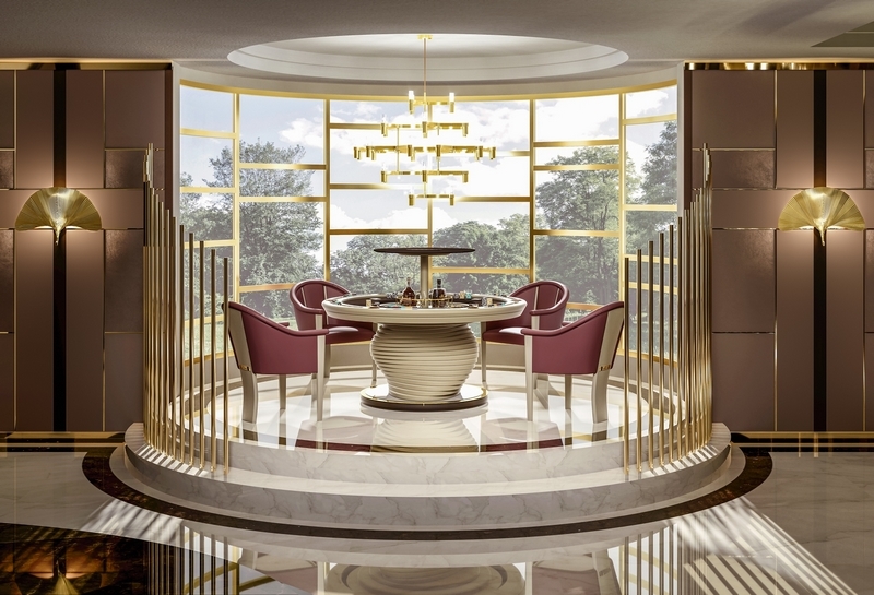 Luxury round poker table with four chairs in an elegant gold-accented game room.