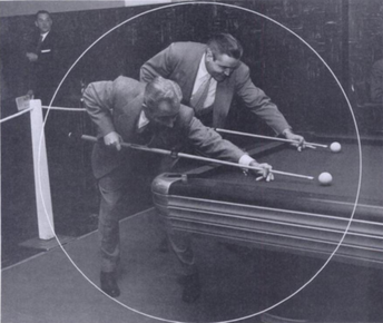 Willie Mosconi shooting pool with opponent.