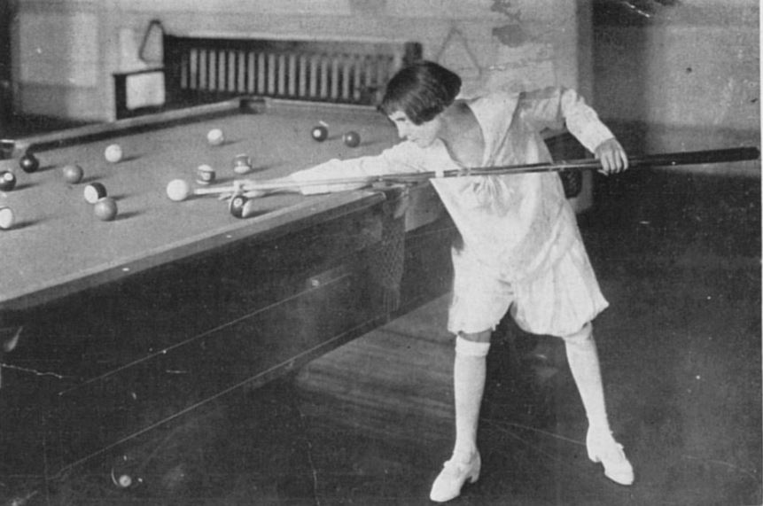 Ruth McGinnis playing pool.